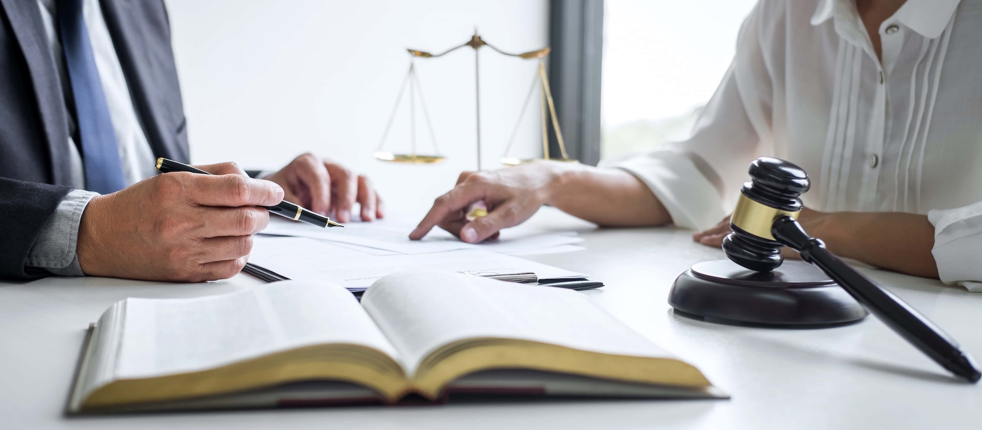 Businesswoman and Male lawyer or judge consult and conference having team meeting with client at law firm in office Law and Legal services concept