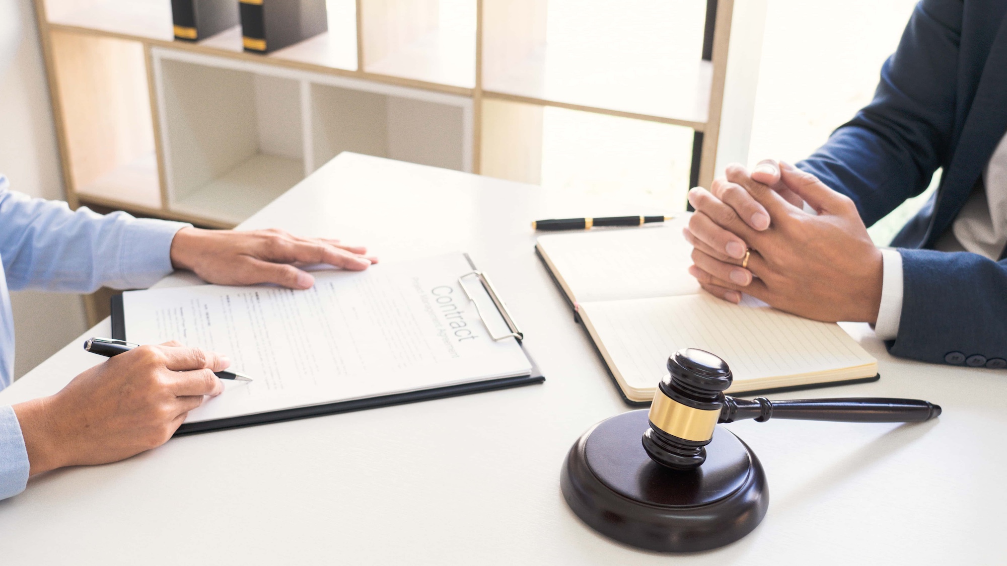 Legal counsel presents to the client negotiating a contract Serious consultations Concepts of Law and Legal services