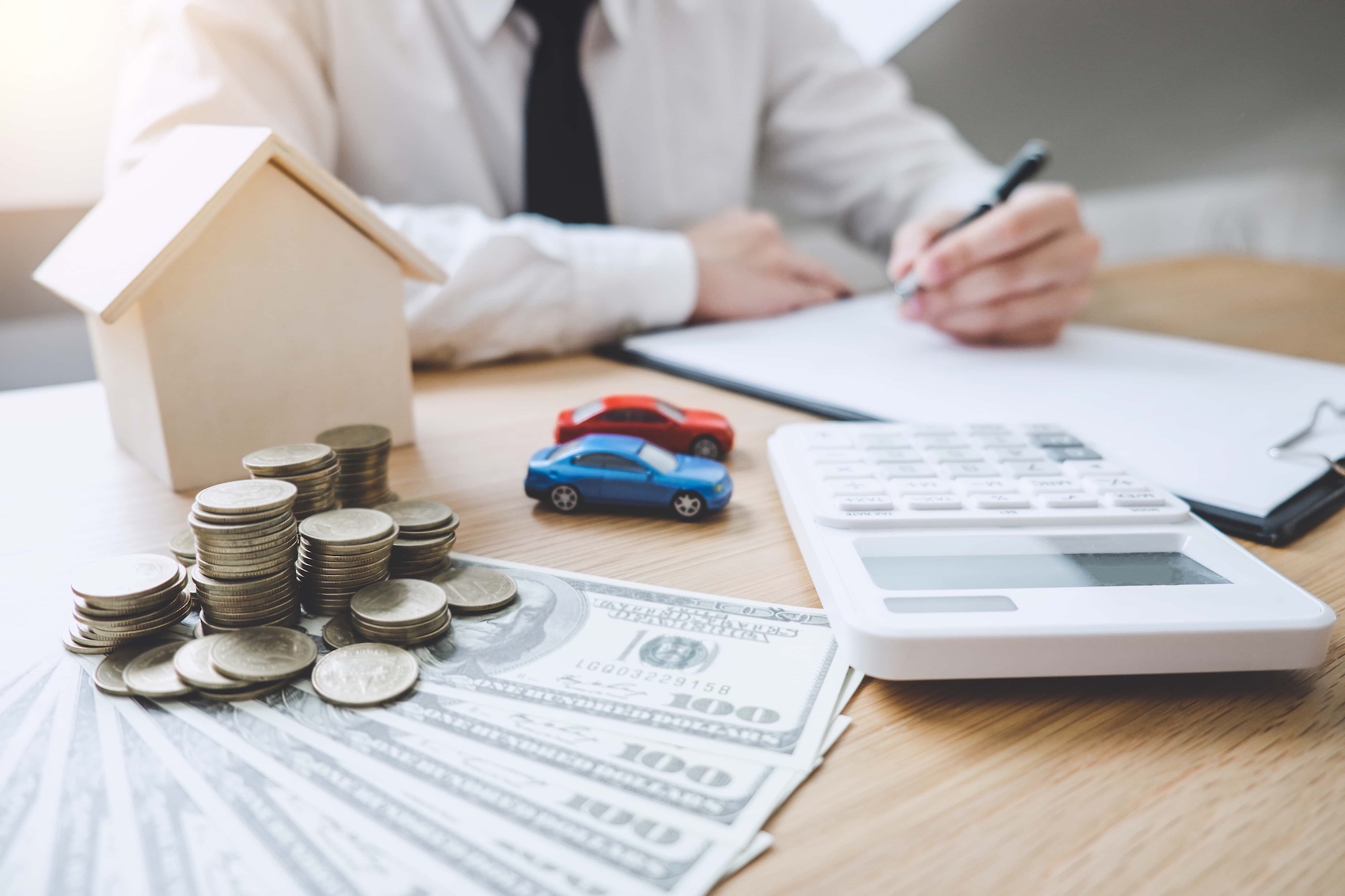 business financing accounting banking concept businessman doing finances and calculate about cost to real estate investment concept mortgage loan approval